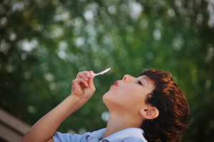 boy blowing bubbles